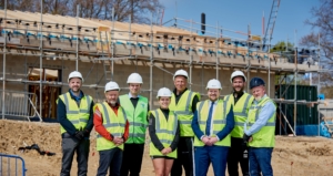 Builders smiling at the finished project of Bodington Football Hub