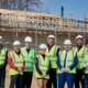Builders smiling at the finished project of Bodington Football Hub