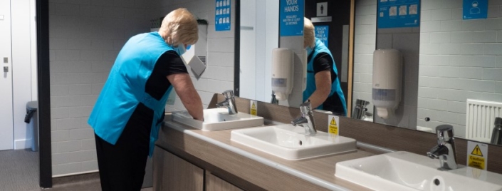 Cleaning Operative cleaning sinks in Newlyn Building