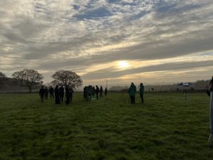 Gair Wood tree planting participants in the sunset
