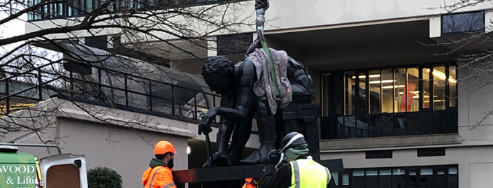 Master of the Universe sculpture outside Edward Boyle library being put into place by constructors.