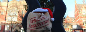 Christmas sack with gifts outside the Beech Grove Plaza Christmas tree