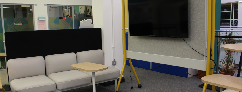 image of area in SU building with TV and co-working space
