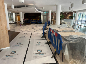 Reception area of the Ziff Building with protective flooring covers