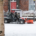 A snow plough clearing snow from a pathway