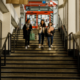 three female students walking down stairs in the Boyle Library