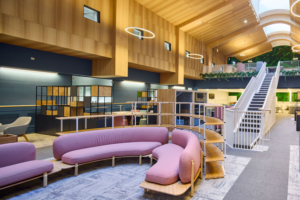 Purple seating area in front of a staircase