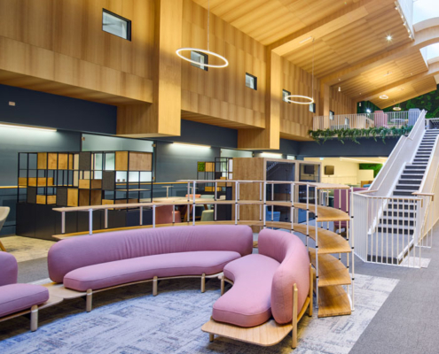 Purple seating area in front of a staircase