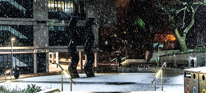 Sign for Art statue in winter time